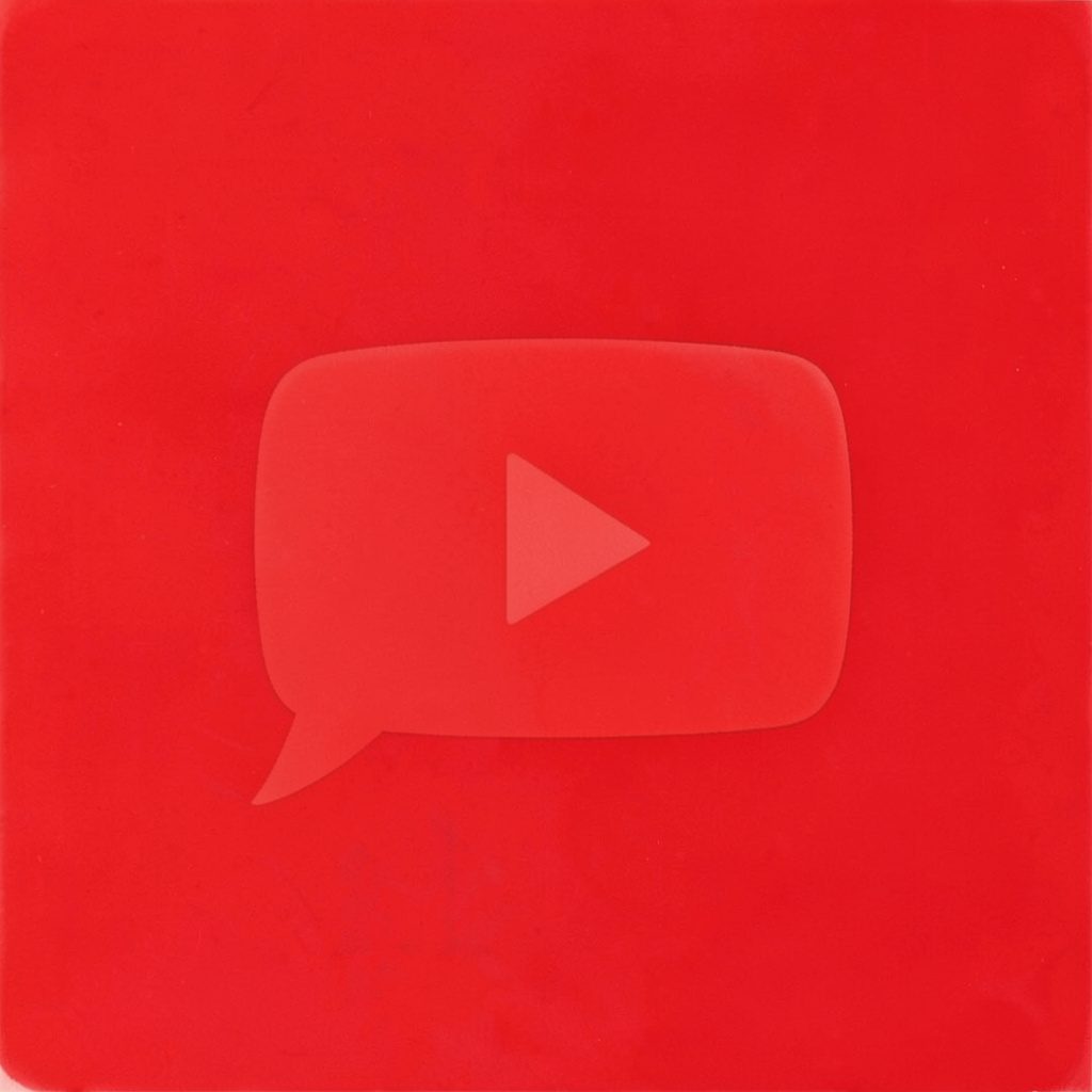 Round YouTube icon in matte red gouache style